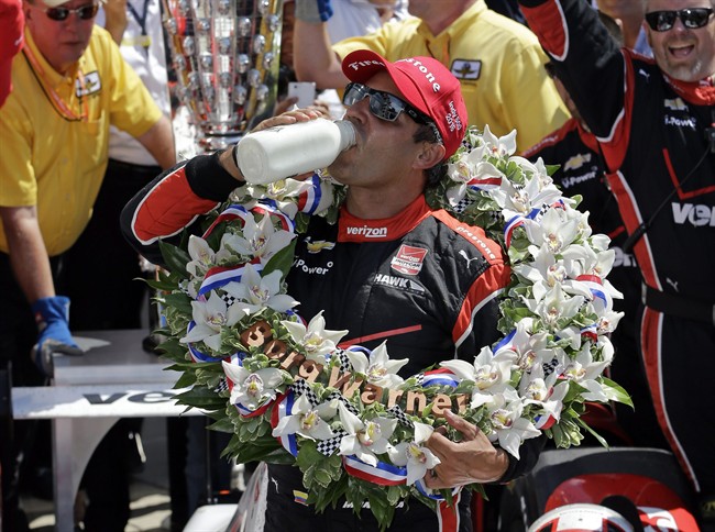 Juan Pablo Montoya, of Colombia, celebrates after winning the 99th running of the Indianapolis 500 auto race at Indianapolis Motor Speedway in Indianapolis, Sunday, May 24, 2015. 