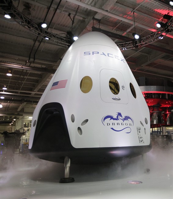 In this May 29, 2014 file photo, The SpaceX Dragon V2 spaceship is unveiled at its headquarters in Hawthorne, Calif. 