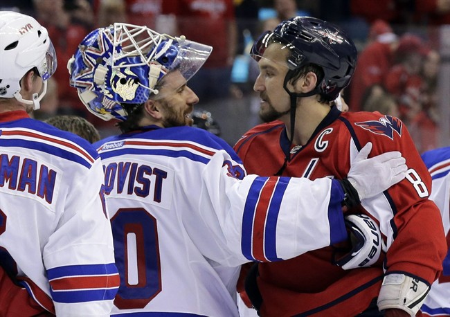 In this May 13, 2013, file photo, New York Rangers goalie Henrik Lundqvist (30), from Sweden, greets Washington Capitals left wing Alex Ovechkin (8), from Russia, after the Rangers won 5-0 in Game 7 in the first round of the NHL hockey Stanley Cup playoffs.
