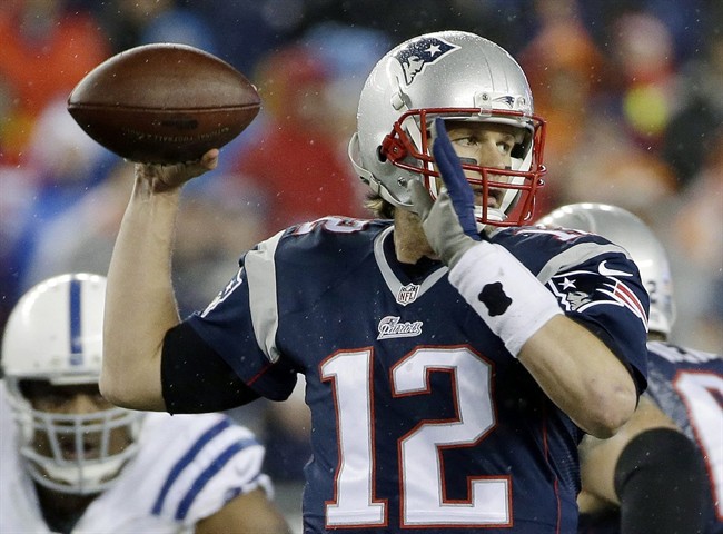 In this Jan. 18, 2015, file photo, New England Patriots quarterback Tom Brady looks to pass during the first half of the NFL football AFC Championship game against the Indianapolis Colts in Foxborough, Mass. 