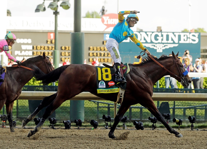 Victor Espinoza rides American Pharoah to victory in the 141st running of the Kentucky Derby horse race at Churchill Downs Saturday, May 2, 2015, in Louisville, Ky. 