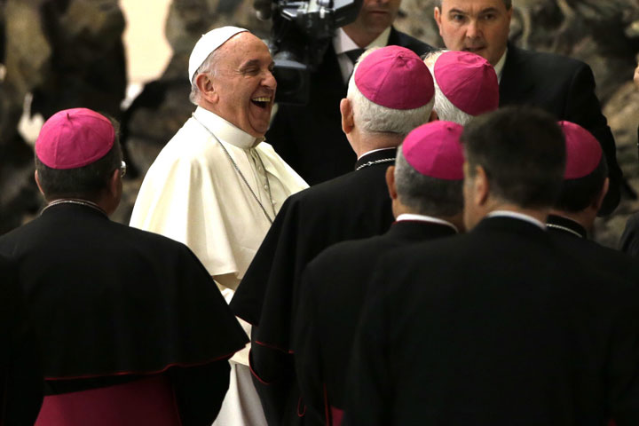 Pope Francis laughs with members of the Cursillos in Christianity movement, in the Paul VI hall, at the Vatican, Thursday, April 30, 2015. 