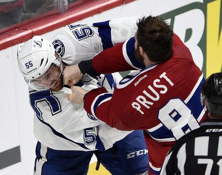 Montreal Canadiens winger Brandon Prust (8) fights with Tampa Bay Lightning defenceman Braydon Coburn (55) during third period of Game 2 NHL second round playoff hockey action Sunday, May 3, 2015 in Montreal.