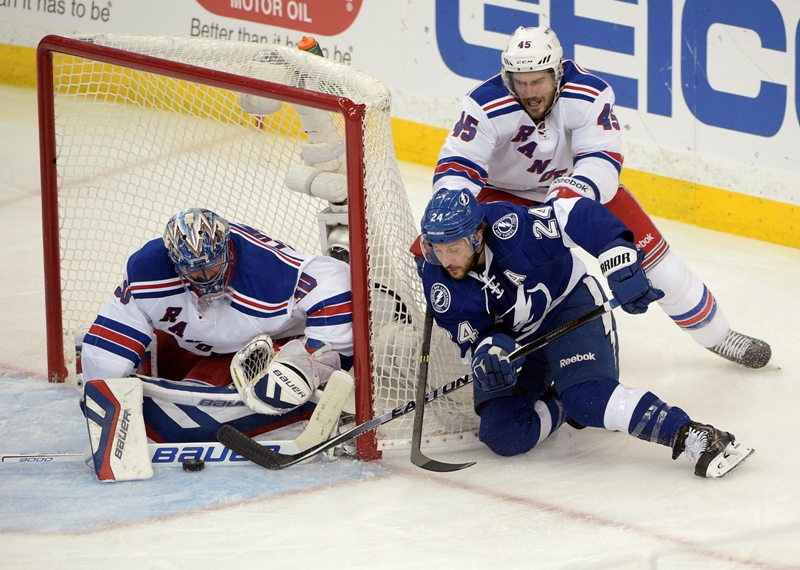 New York Rangers goalie Henrik Lundqvist (30), of Sweden, stops a shot from Tampa Bay Lightning right wing Ryan Callahan (24) as Rangers left wing James Sheppard (45) defends, during the second period of Game 6 of the Eastern Conference finals in the NHL hockey Stanley Cup playoffs, Tuesday, May 26, 2015, in Tampa, Fla. 
