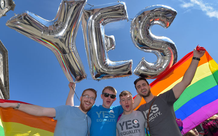 Supporters in favour of same-sex marriage pose for a photograph as thousands gather in Dublin Castle square awaiting the referendum vote outcome.