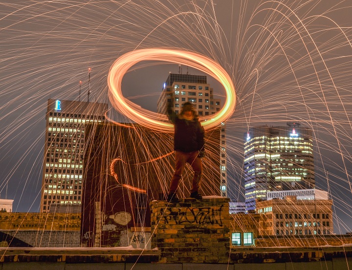 Kyle Schappert lights up the Winnipeg skyline using long exposures, steel wool and fire.