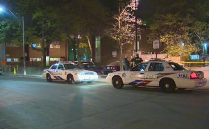 Toronto police investigate a shooting near Dundas and Spadina on May 22, 2014.