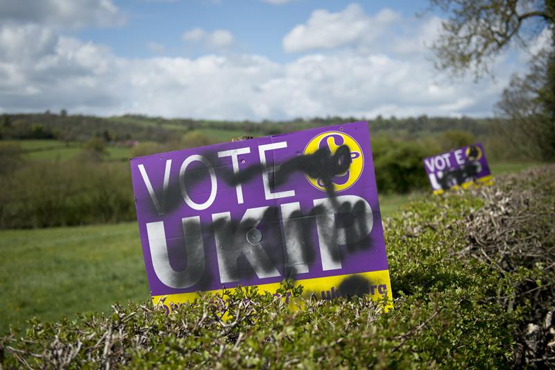 Election posters for the UK Independence Party (UKIP) stand defaced in the 'Derbyshire Dales on on April 28, 2015.
