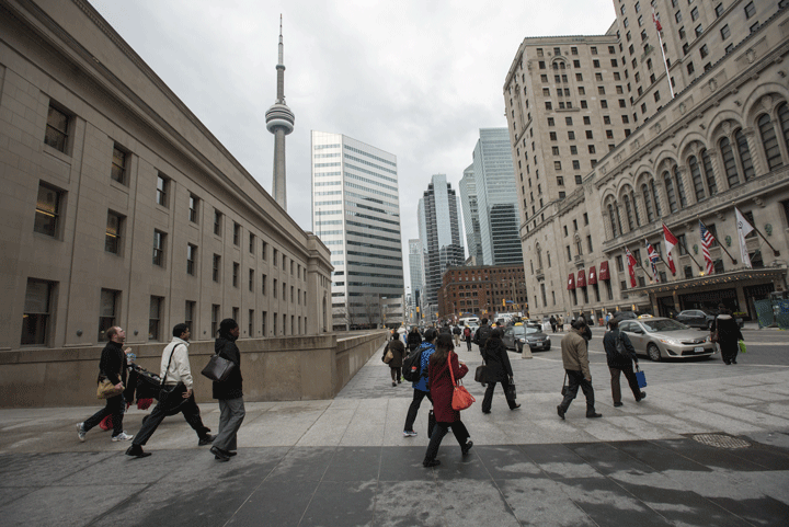 Commuters head onto Front St. West and to work work after leaving on Union Station on April 22 2015.