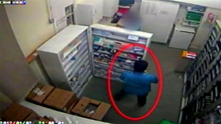 Victorino Chua seen here collecting drugs from the pharmacy on hospital CCTV. Chua was found guilty of murdering two patients and poisoning others, Manchester, Britain - 18 May 2015.