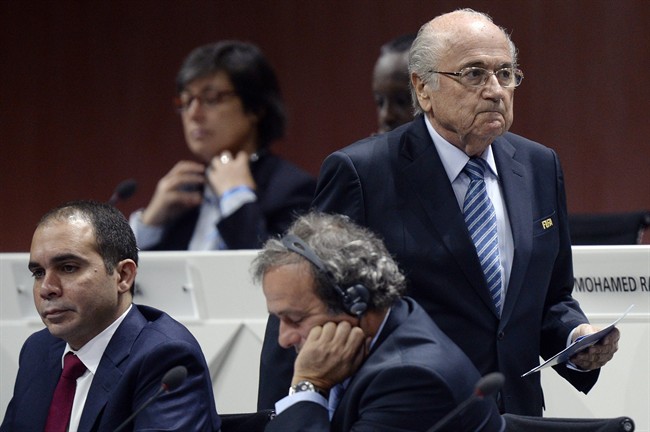FIFA president Joseph S. Blatter, right, walks past Prince Ali bin al-Hussein, left, and UEFA President Michel Platini, center, during the 65th FIFA Congress held at the Hallenstadion in Zurich, Switzerland, Friday, May 29, 2015.