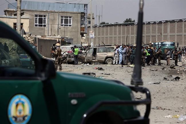 Afghan security forces inspect the site of suicide attack near an international airport in Kabul, Afghanistan, Sunday, May 17.