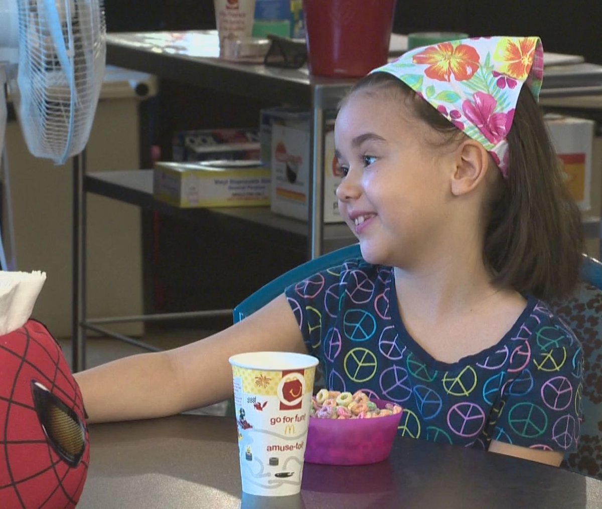 Cassie, the 'House Hero', enjoys breakfast with her family at the Ronald McDonald House. 