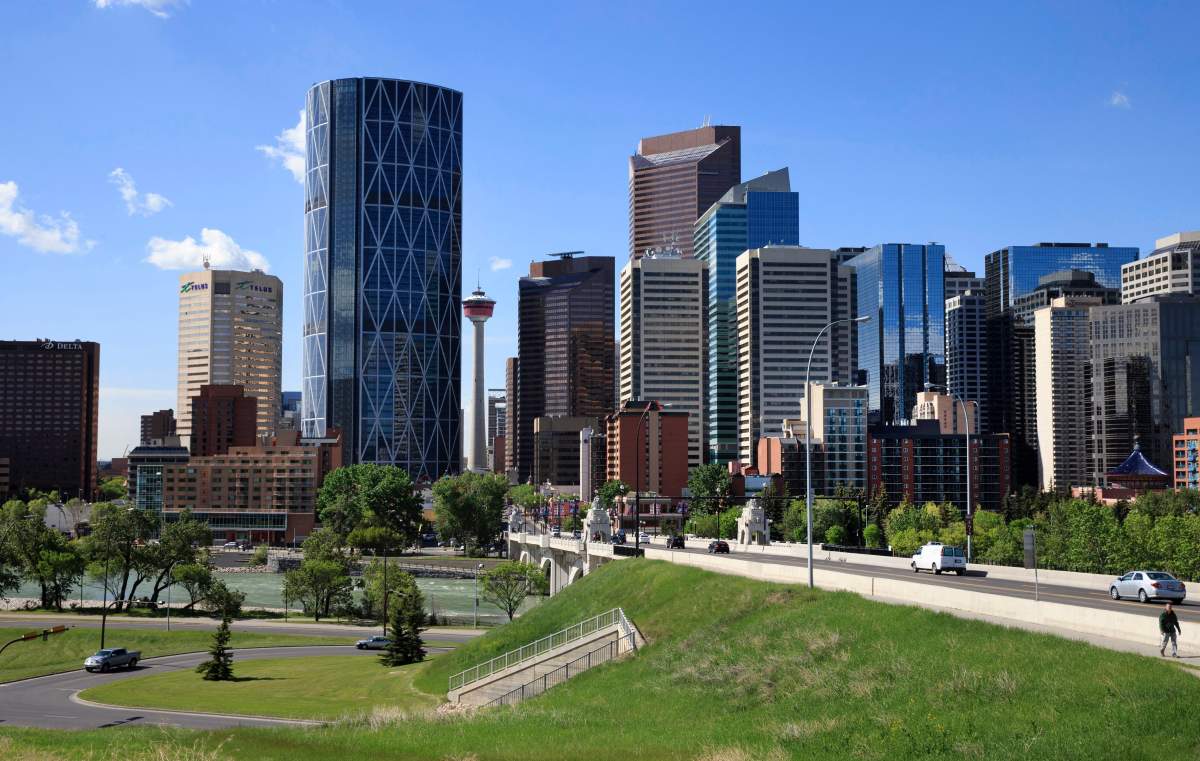 Downtown Calgary with the Centre Street Bridge and Bow River in the foreground at Calgary, Alberta on June 10, 2014. THE CANADIAN PRESS IMAGES/Larry MacDougal