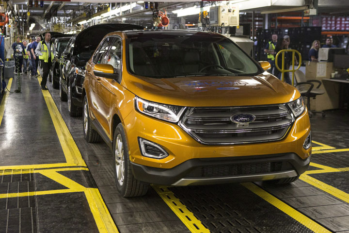 A new Ford Edge stands at the front of a production line at the Ford Assembly Plant in Oakville, Ont., on Thursday, February 26, 2015.