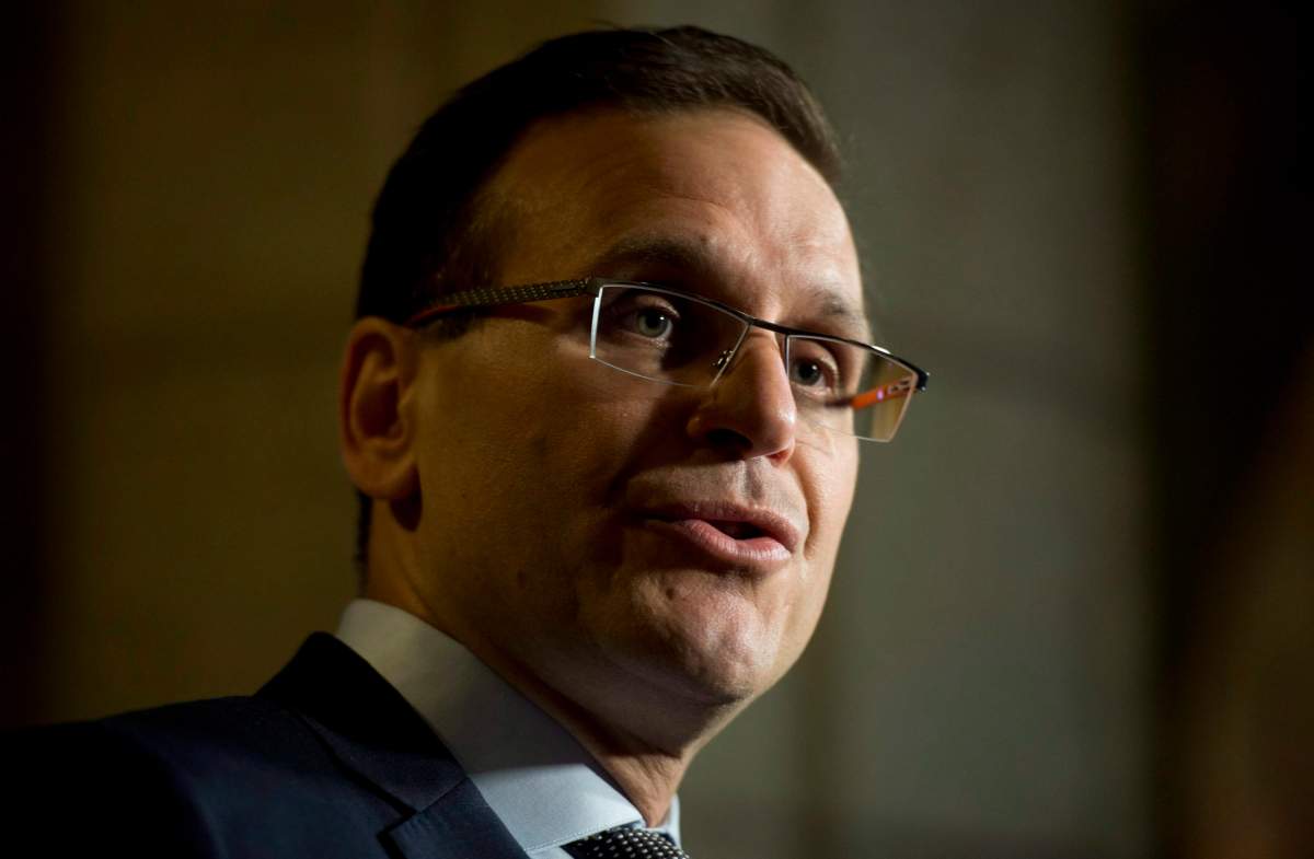 Conservative Sen. Leo Housakos speaks with the media in the Foyer of the Senate on Parliament Hill in Ottawa, Tuesday, May 26, 2015.  THE CANADIAN PRESS/Adrian Wyld.