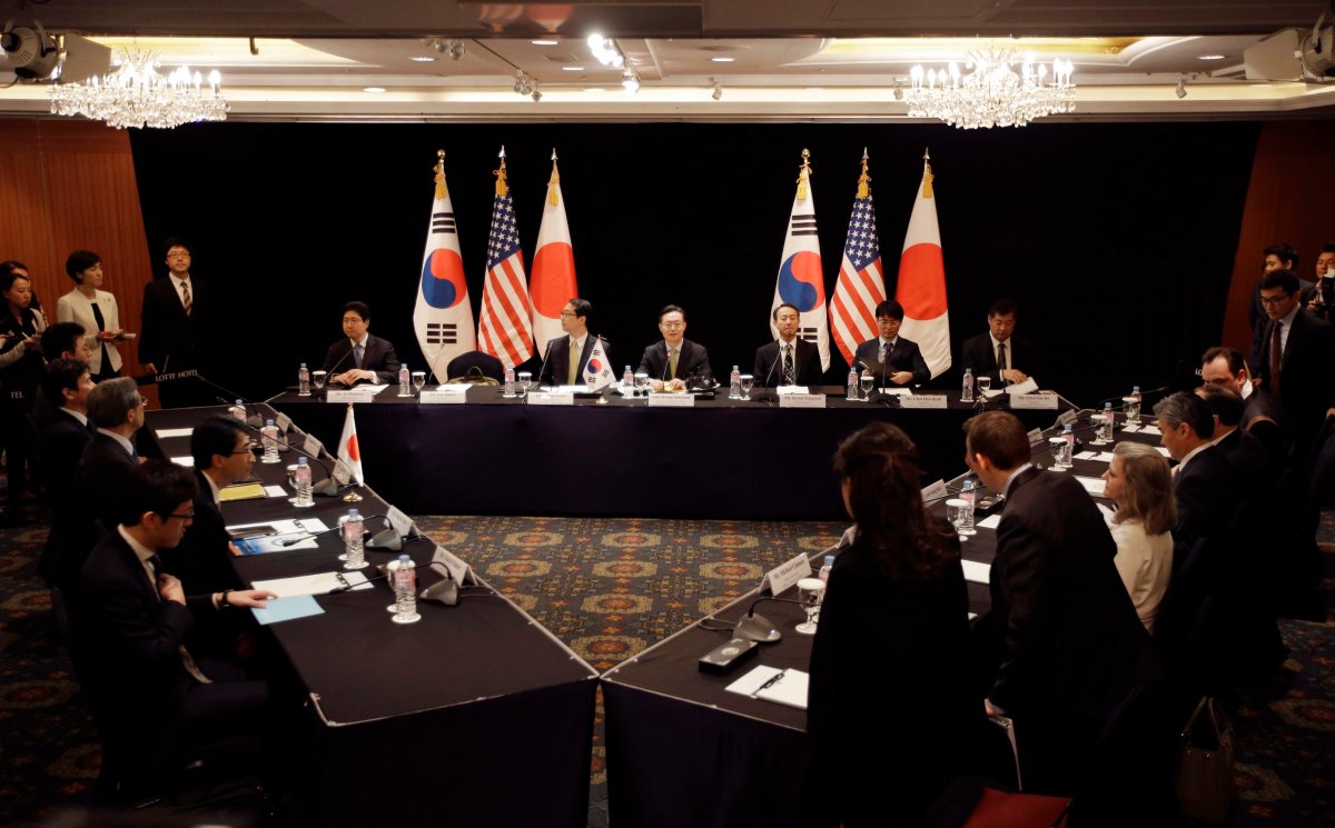 South Korea's delegation, center, U.S. delegation, right, and Japan's delegation, left, attend their meeting about North Korea in Seoul, South Korea, Wednesday, May 27, 2015.