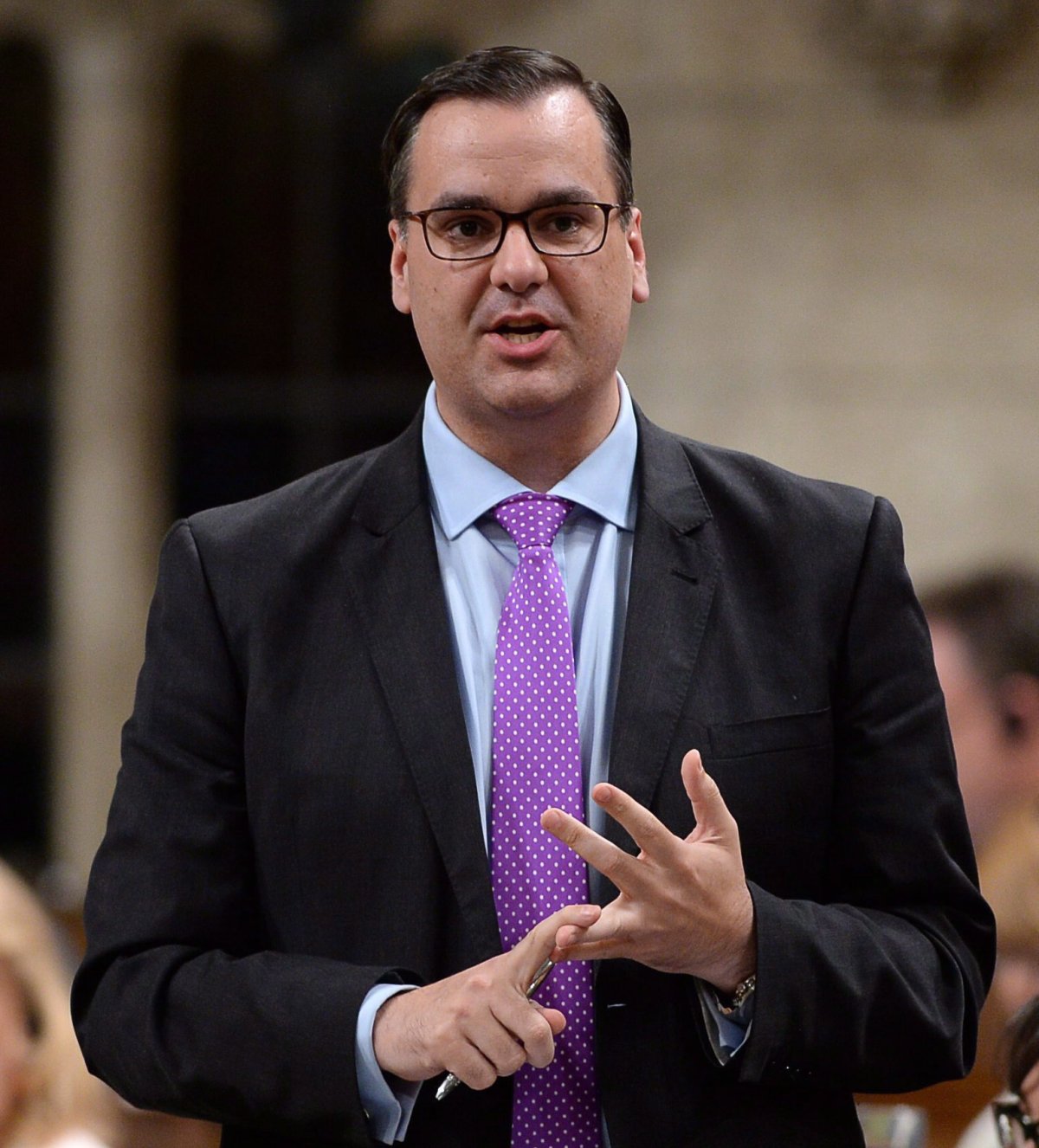 Industry Minister James Moore answers a question during Question Period in the House of Commons in Ottawa on Thursday, May 28, 2015.