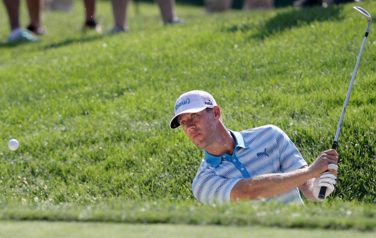 Graham DeLaet hits from the sand on the eighth hole during the second round of the Memorial golf tournament, Friday, June 5, 2015, in Dublin, Ohio. 