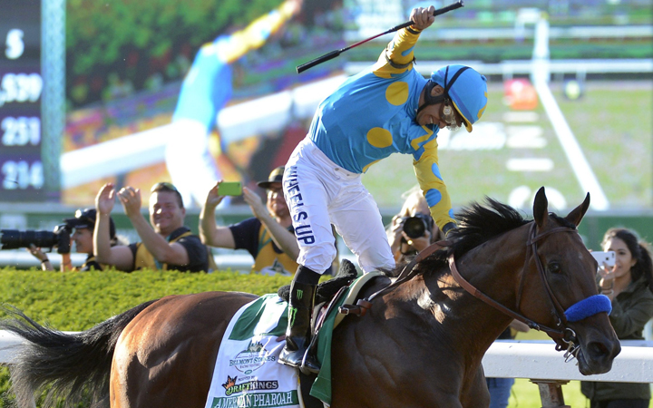 Victor Espinoza reacts after crossing the finish line with American Pharoah to win the 147th running of the Belmont Stakes horse race at Belmont Park, Saturday, June 6, 2015, in Elmont, N.Y.