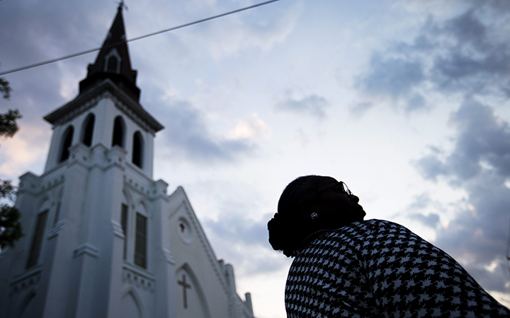 Doris Simmons, of Charleston, S.C. stands next to Emanuel AME Church, the scene of the mass shooting that left nine dead.