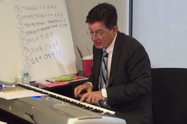 Stephen Colbert works on a theme song.