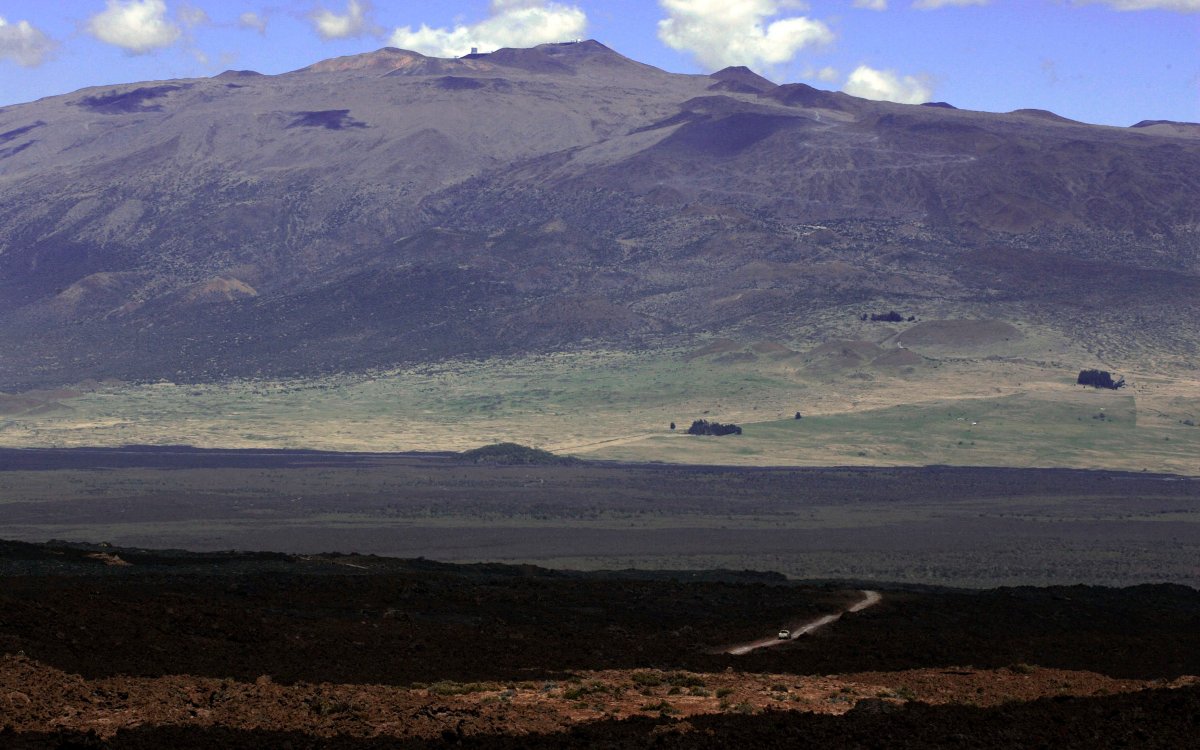 A truck driving down the narrow, windy road from Mauna Loa Observatory atmospheric research facility on the island of Hawaii.