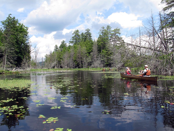 This file photo shows canoeists paddling between Third and Fourth lakes in the Essex Chain Lakes tract near Newcomb, N.Y.  