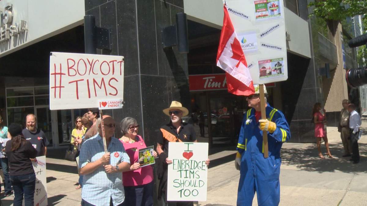 Protesters gather outside a Tim Hortons restaurant in June.