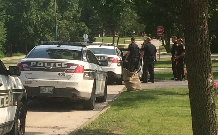 Police on Carlotta Crescent in Winnipeg on Friday, June 26, 2015
