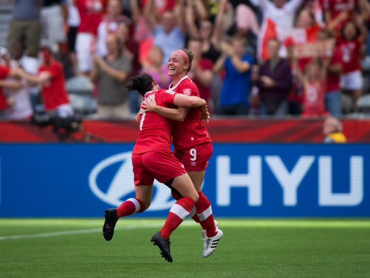 Canada's Josee Belanger, right, and Rhian Wilkinson celebrate Belanger's goal against Switzerland during the second half of the FIFA Women's World Cup round of 16 soccer action in Vancouver, B.C., on Sunday, June 21, 2015.