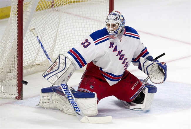 The puck rings off the post behind New York Rangers goalie Cam Talbot during first period NHL action against the Ottawa Senators in Ottawa on March 26, 2015. The Edmonton Oilers got their goaltender. On a busy morning of trades at the NHL draft, the Oilers acquired Cam Talbot from the New York Rangers.