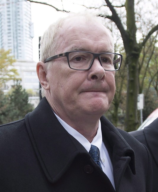 John Furlong leaves British Columbia's Supreme Court in Vancouver, Monday, March 30, 2015.