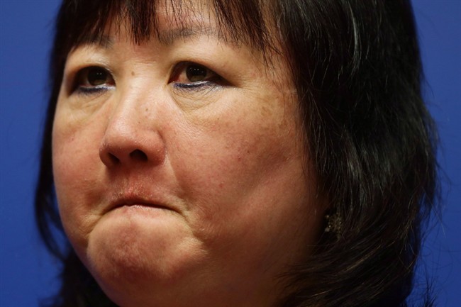 Amanda Todd's mother Carol Todd attends an RCMP news conference in Surrey, B.C., on Thursday April 17, 2014. The mother of a B.C. teen who has said her daughter took her own life because of sexual exploitation is disturbed that someone appears to have stolen a memorial plaque from her garden. THE CANADIAN PRESS/Darryl Dyck.