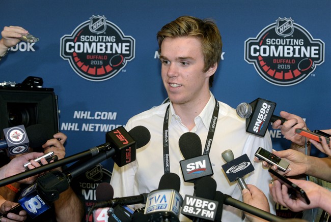Connor McDavid, answers a question about being the center of media attention during the NHL Combine, Friday, June 5, 2015, in Buffalo, N.Y. McDavid's whirlwind pre-draft tour is taking him to the Stanley Cup final in Chicago.