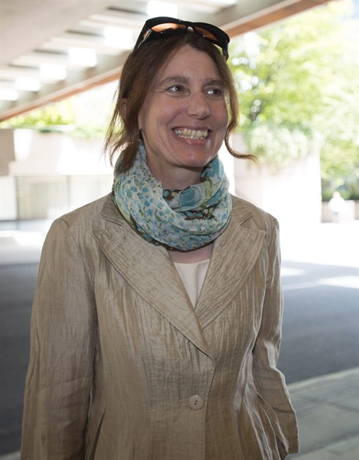 FILE PHOTO: Freelance journalist Laura Robinson is shown arriving at B.C. Supreme Court in Vancouver, B.C. Monday, June 15 2015. THE CANADIAN PRESS/Jonathan Hayward.