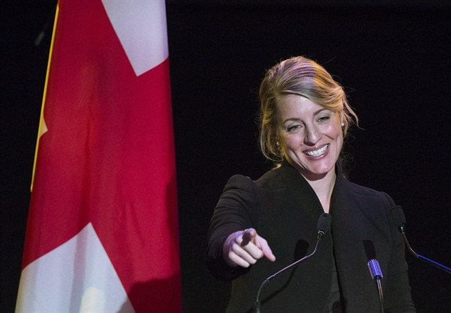 Former Montreal mayoral candidate Melanie Joly gestures as she speaks to supporters at her campaign headquarters on provincial election night in Montreal on November 3, 2013. Joly is seeking the Liberal nomination in Montreal's Ahuntsic-Cartierville riding.