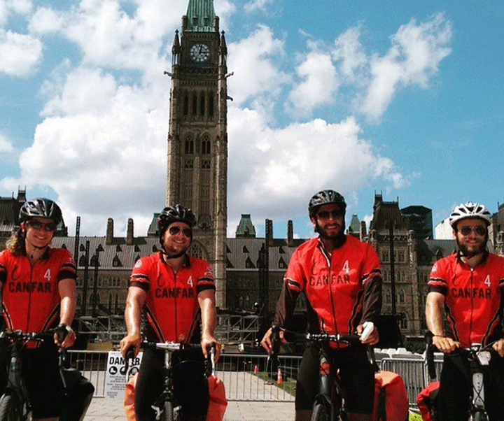 The Cycle4CANFAR team stops at Parliament Hill.