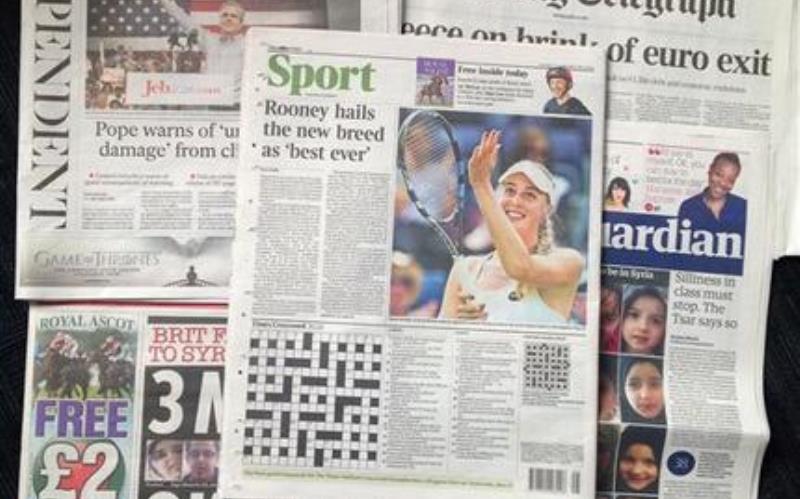 A combo taken on Wednesday June 17, 2015 showing some of the British national newspapers of Tuesday June 16 and featuring at centre the back page of The Times showing it's daily crossword puzzle. 