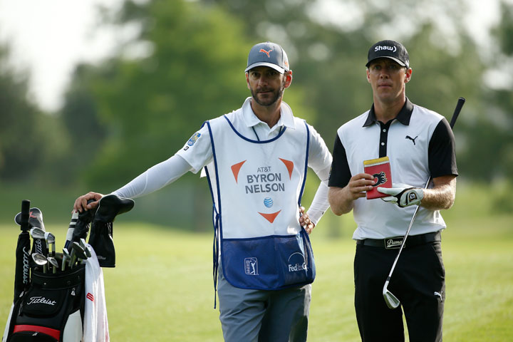 Graham DeLaet of Canada looks on with his caddie on the 15th hole during Round One of the AT&T Byron Nelson at the TPC Four Seasons Resort Las Colinas on May 28, 2015 in Irving, Texas.