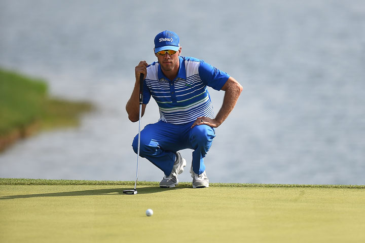 Graham DeLaet of Canada lines up a putt on the eighteenth green during the second round of the Shell Houston Open at the Golf Club of Houston on April 3, 2015 in Humble, Texas.