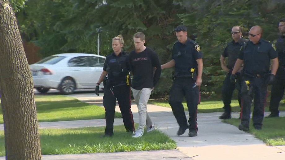 Aaron Driver, 23, is taken into custody on Carlotta Crescent in Winnipeg on Friday, June 26, 2015.