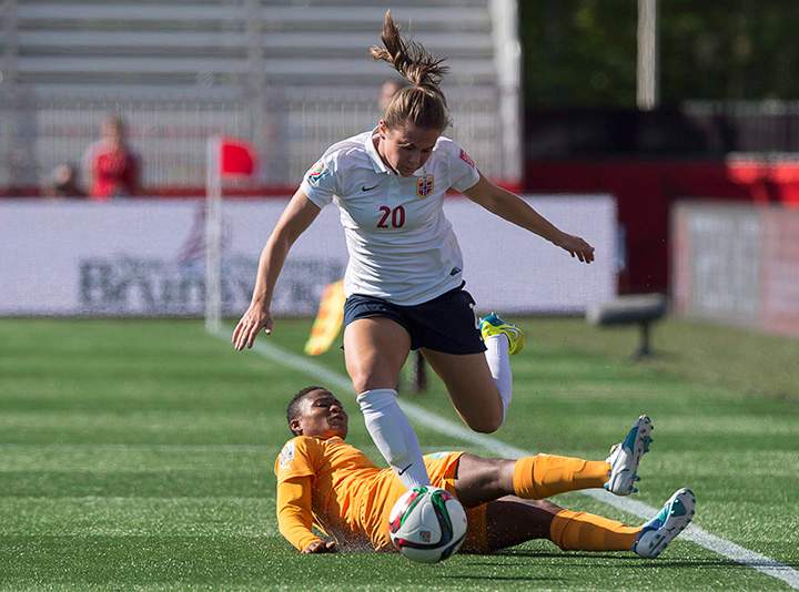Norway's Emilie Haavi heads past Ivory Coast's Ida Guehai during FIFA Women's World Cup first half soccer action in Moncton, N.B., on Monday, June 15, 2015. 