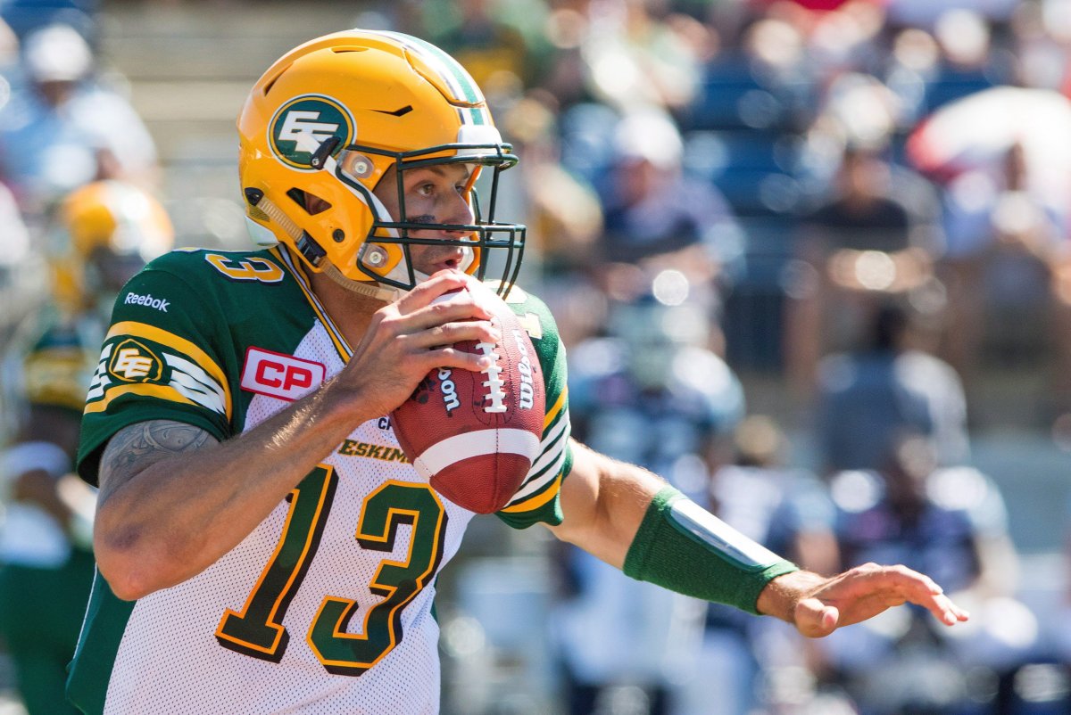 Edmonton Eskimos quarterback Mike Reilly (13) looks down field during first half CFL football action against the Toronto Argonauts in Fort McMurray, Alta., on Saturday, June 27, 2015. 