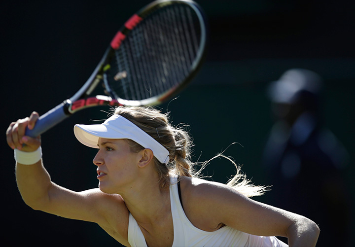 Canada’s Eugenie Bouchard returns to Ying-Ying Duan of China during the singles first round match at the All England Lawn Tennis Championships in Wimbledon, London on Tuesday June 30, 2015. 