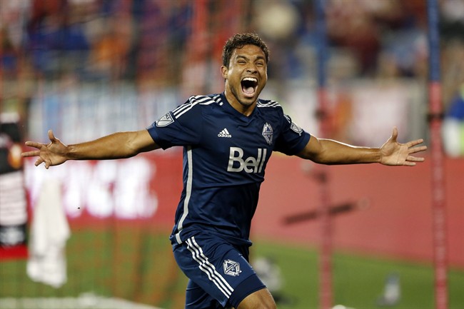 Vancouver Whitecaps FC midfielder Kianz Froese celebrates after scoring a goal against the New York Red Bulls during the second half of an MLS soccer match, Saturday, June 20, 2015, in Harrison, N.J.