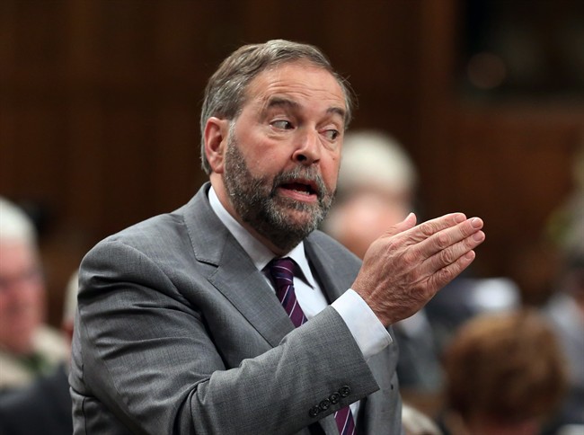 NDP Leader Thomas Mulcair stands in the House of Commons during Question Period on Parliament Hill, Wednesday, June 10, 2015 in Ottawa.