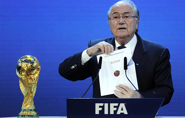FIFA President Joseph Blatter holds up the name of Russia during the official announcement of the 2018 World Cup host country on December 2, 2010 at the FIFA headquarters in Zurich. 