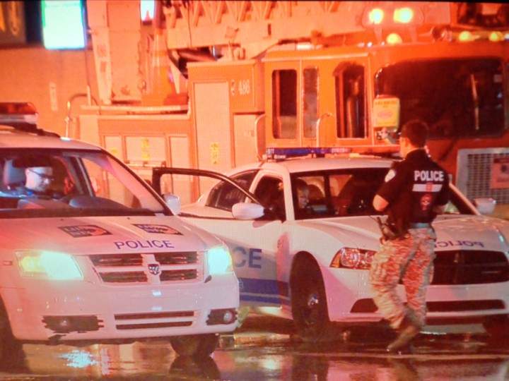 Police officers on the scene of a suspicious fire at Galeries Lachine on Wednesday, June 17, 2015.