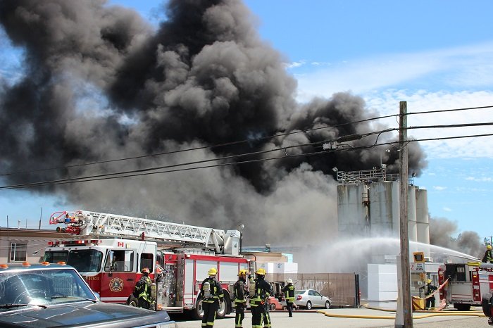 Crews fight a large fire at Mansonville Plastics in Surrey.